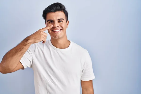 Hispanic Man Standing Blue Background Pointing Hand Finger Face Nose — 图库照片