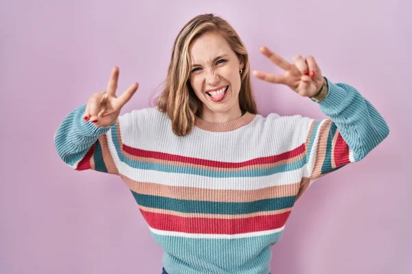Young Blonde Woman Standing Pink Background Smiling Tongue Out Showing — Foto Stock