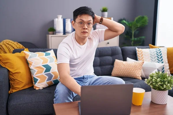 Young Asian Man Using Laptop Home Sitting Sofa Crazy Scared — Stock Photo, Image