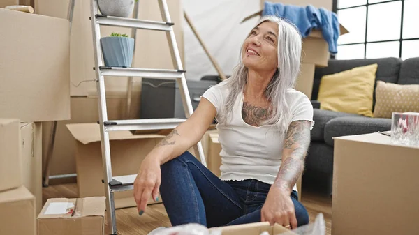 Middle Age Grey Haired Woman Smiling Confident Sitting Floor New — ストック写真