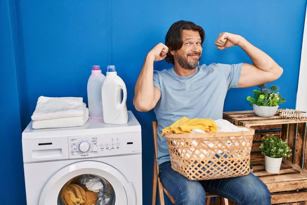 Handsome Middle Age Man Waiting Laundry Showing Arms Muscles Smiling — Stock Photo, Image