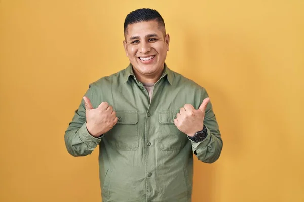 Hispanic Young Man Standing Yellow Background Success Sign Doing Positive — Stock Photo, Image