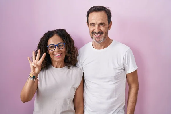 Middle Age Hispanic Couple Together Pink Background Showing Pointing Fingers — Stock Photo, Image
