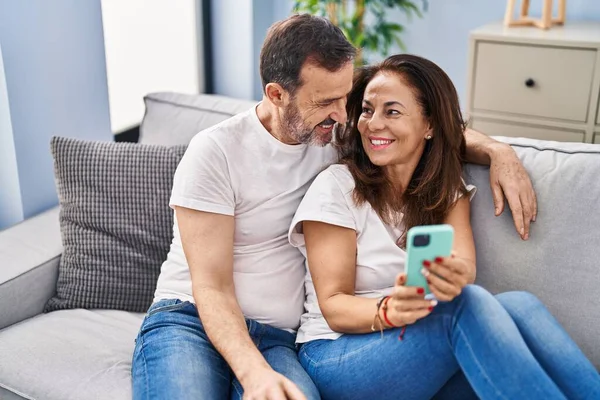 Middle Age Man Woman Couple Using Smartphone Sitting Sofa Home — Stock Photo, Image