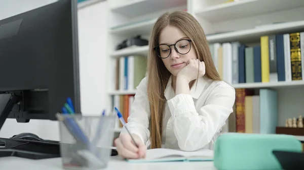 Young Blonde Woman Student Using Computer Writing Notebook University Classroom — Stockfoto