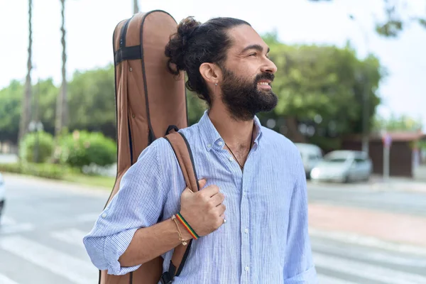 Young Hispanic Man Musician Smiling Confident Holding Guitar Case Street — Stockfoto