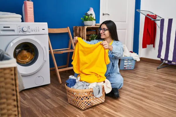 Young Hispanic Woman Holding Towel Washing Clothes Laundry Room —  Fotos de Stock