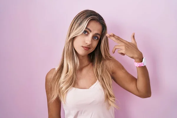 Young Blonde Woman Standing Pink Background Shooting Killing Oneself Pointing — Foto Stock