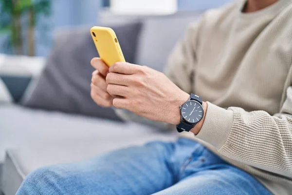 Young Arab Man Using Smartphone Sitting Sofa Home — Stockfoto