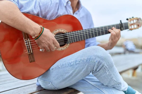 Young Hispanic Man Musician Playing Classical Guitar Sitting Bench Seaside — Fotografia de Stock