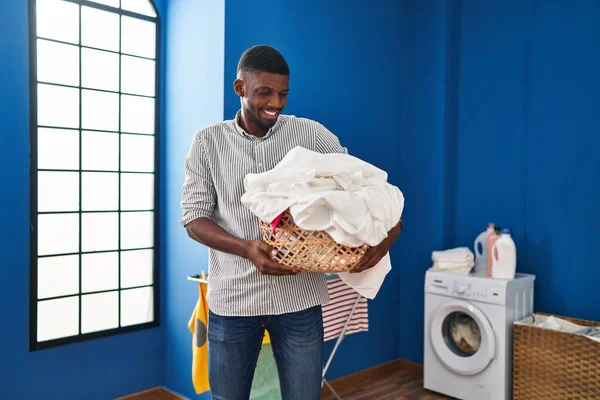 Young African American Man Smiling Confident Holding Basket Clothes Laundry — Fotografia de Stock