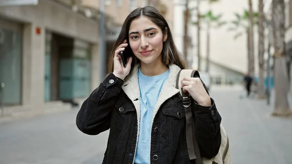 Young Beautiful Hispanic Woman Student Smiling Confident Talking Smartphone Street — Stock fotografie