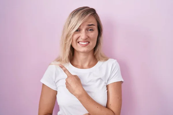 Young Blonde Woman Standing Pink Background Pointing Aside Worried Nervous — Fotografia de Stock