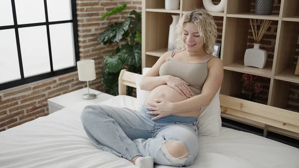 Young Pregnant Woman Touching Belly Sitting Bed Bedroom — Stok fotoğraf