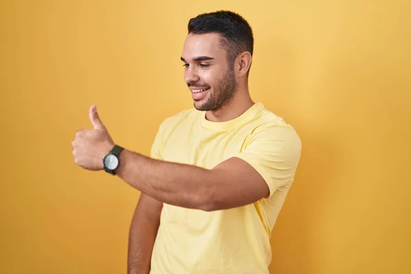 Young Hispanic Man Standing Yellow Background Looking Proud Smiling Doing — 스톡 사진