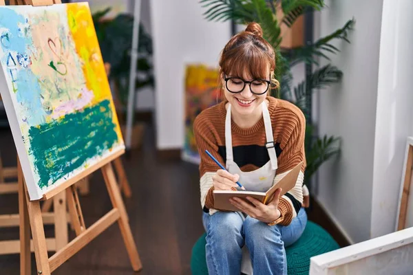 Young Woman Artist Smiling Confident Writing Book Art Studio — Stock Photo, Image