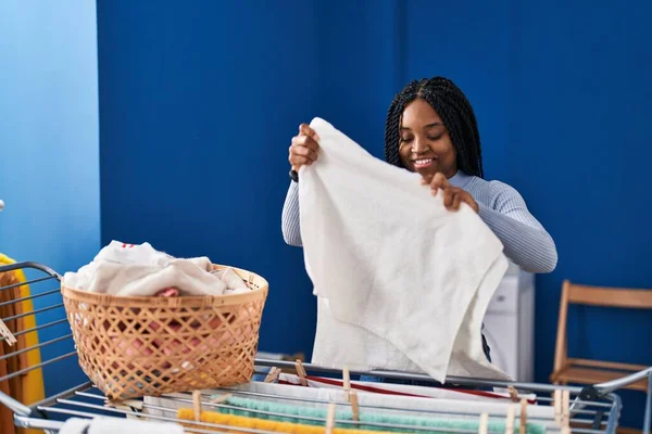 African American Woman Smiling Confident Hanging Clothes Clothesline Laundry Room — Stockfoto