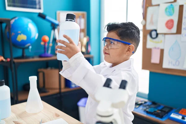 Adorable Hispanic Boy Student Smiling Confident Holding Bottle Liquid Laboratory — Stock Photo, Image