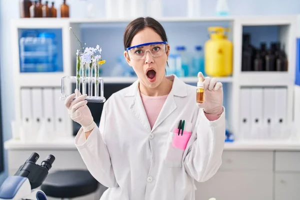 Young Brunette Woman Working Scientist Laboratory Shock Face Looking Skeptical — Zdjęcie stockowe