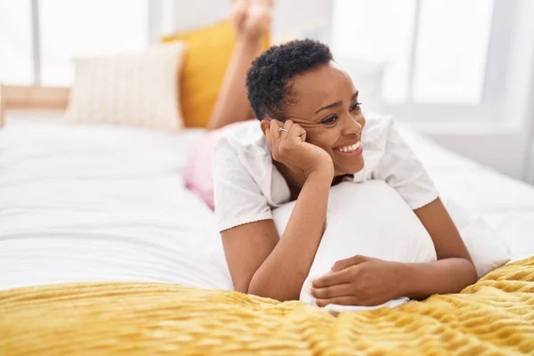 African American Woman Smiling Confident Lying Bed Bedroom —  Fotos de Stock