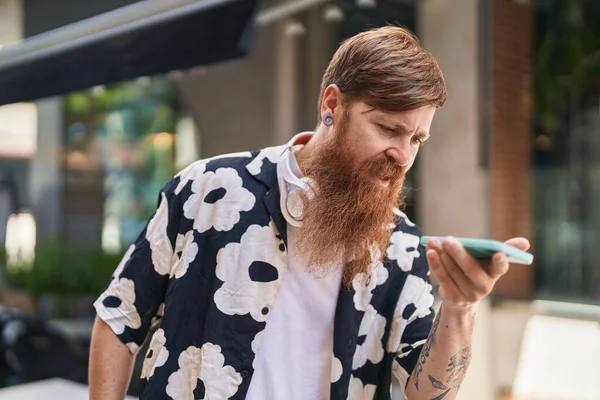 Young Redhead Man Talking Smartphone Serious Expression Street — Fotografia de Stock