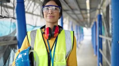 Young beautiful hispanic woman architect smiling confident standing at street