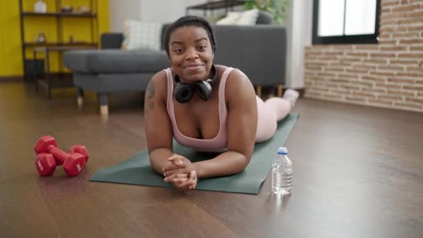 African American Woman Smiling Confident Lying Yoga Mat Home — Stock Video