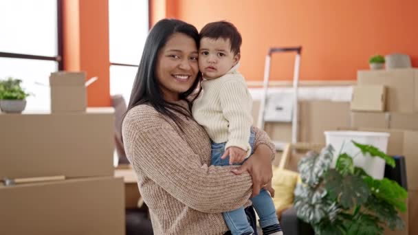 stock video Couple and son kissing and hugging each other standing at new home