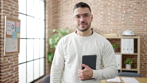 Young Hispanic Man Business Worker Smiling Confident Using Touchpad Office — Stok video