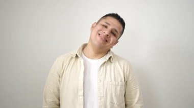 Young hispanic man smiling confident standing over isolated white background