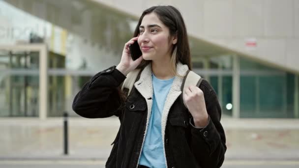 Young Beautiful Hispanic Woman Student Smiling Confident Talking Smartphone Street — ストック動画