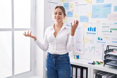 Young blonde woman business worker speaking at office