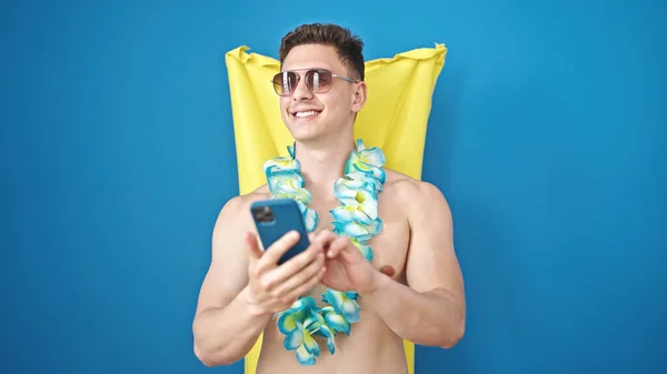 Young Hispanic Man Tourist Using Smartphone Relaxed Inflatable Pool Hammock — Stock Photo, Image