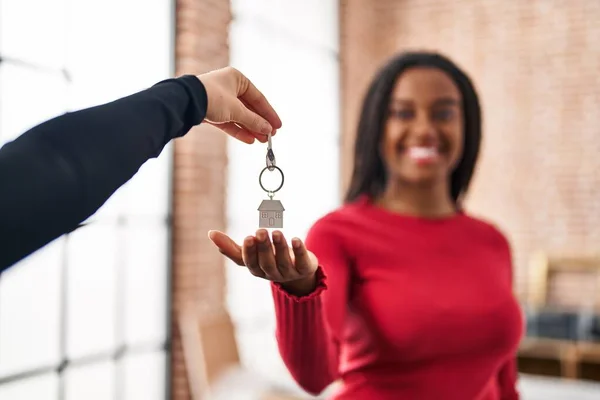 African American Woman Smiling Confident Holding Key New Home — Stock Fotó