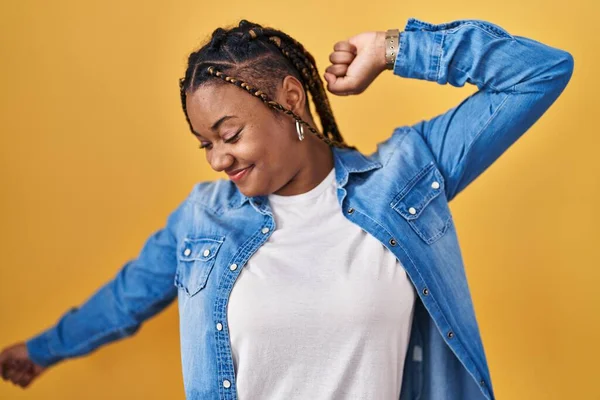 African American Woman Braids Standing Yellow Background Stretching Back Tired — Stock Photo, Image