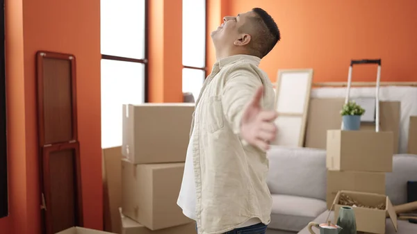 Young Hispanic Man Smiling Confident Opening Arms New Home — ストック写真