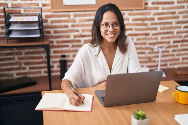 Young Hispanic Woman Business Worker Using Laptop Writing Notebook Office —  Fotos de Stock