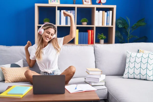 Young Blonde Woman Student Sitting Sofa Listening Music Dancing Home — Stockfoto