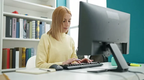 Young Blonde Woman Student Using Computer Studying University Classroom —  Fotos de Stock