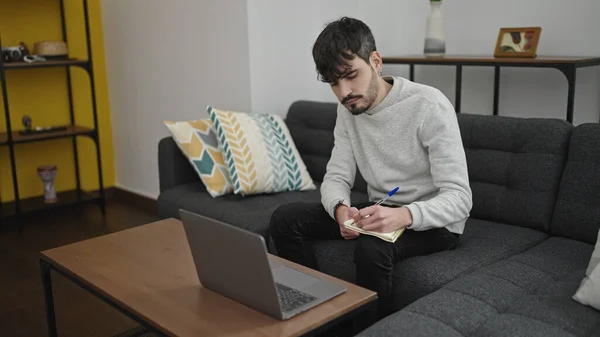 Young Hispanic Man Using Laptop Sitting Sofa Home — Zdjęcie stockowe