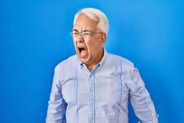 Hispanic Senior Man Wearing Glasses Angry Mad Screaming Frustrated Furious — Stock Photo, Image