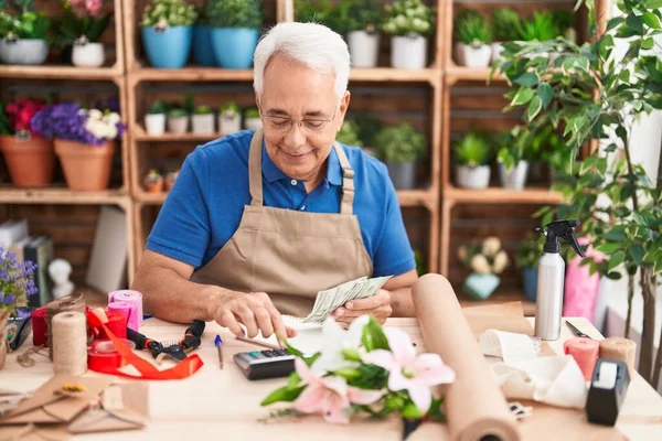 Middle Age Grey Haired Man Florist Smiling Confident Counting Dollars — Stockfoto