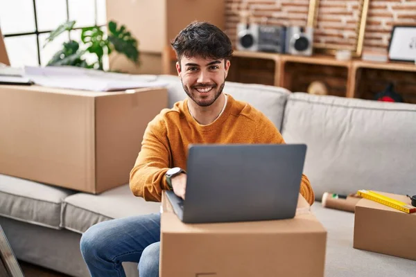 Young Hispanic Man Smiling Confident Using Laptop New Home — Foto de Stock