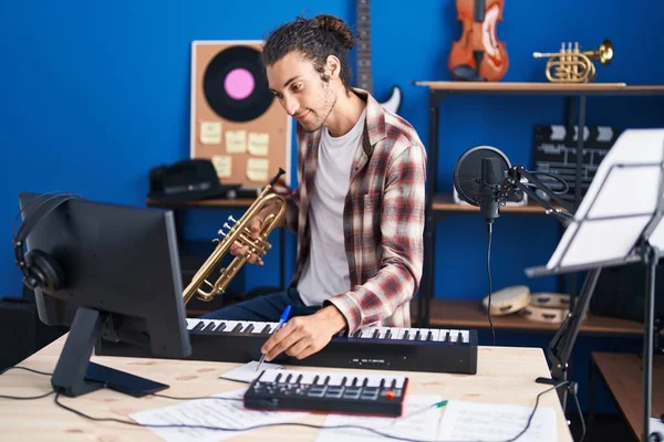 Young Hispanic Man Musician Composing Song Holding Trumpet Music Studio — Stock Photo, Image