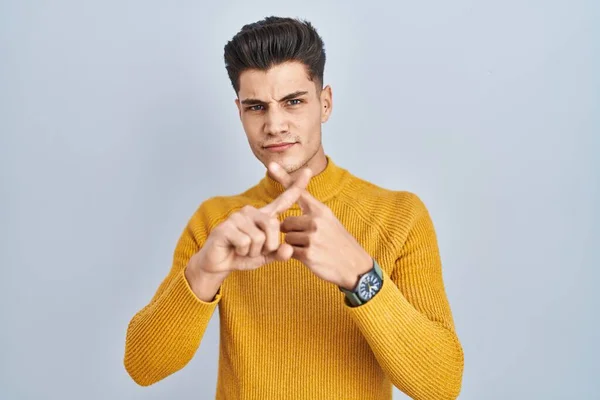Young Hispanic Man Standing Blue Background Rejection Expression Crossing Fingers — Foto Stock