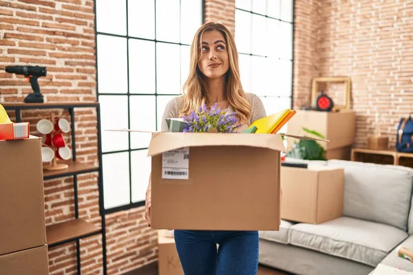 Young Blonde Woman Moving New Home Holding Cardboard Box Smiling — Stock Photo, Image