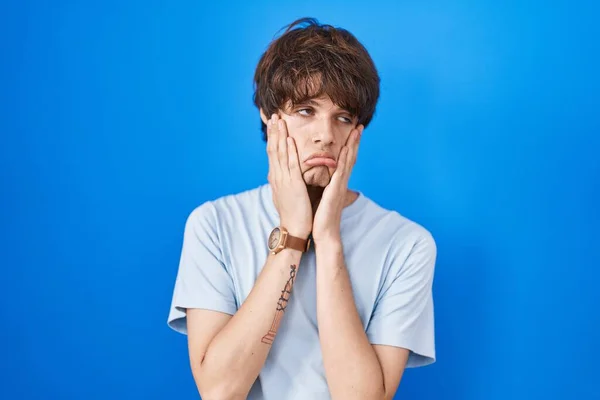 Hispanic Young Man Standing Blue Background Tired Hands Covering Face — Φωτογραφία Αρχείου
