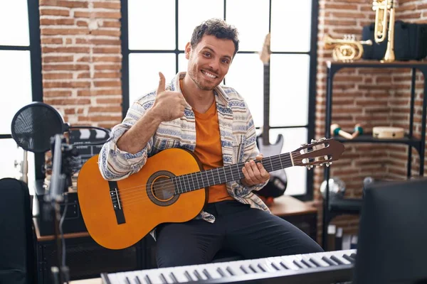 Young Hispanic Man Playing Classic Guitar Music Studio Smiling Happy — Stockfoto