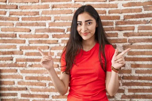 Young Teenager Girl Standing Bricks Wall Smiling Confident Pointing Fingers — Stock Photo, Image