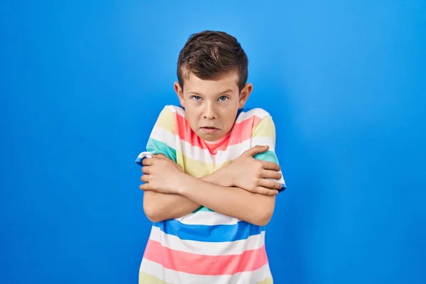 Young Caucasian Kid Standing Blue Background Shaking Freezing Winter Cold — Stock Photo, Image